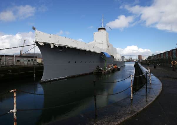 HMS Caroline is moored up near the old pump house in the Titanic Quarter of east Belfast
