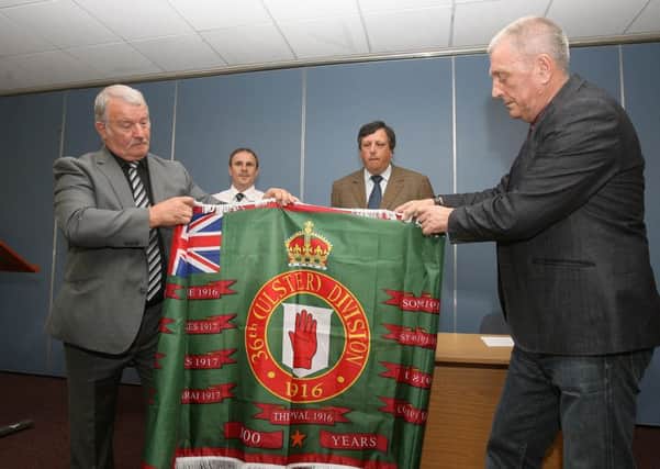 David Campbell(back, right)at Somme flag unveiling by loyalists,from left,Jim Wilson,Winston Irvine,Jackie McDonald