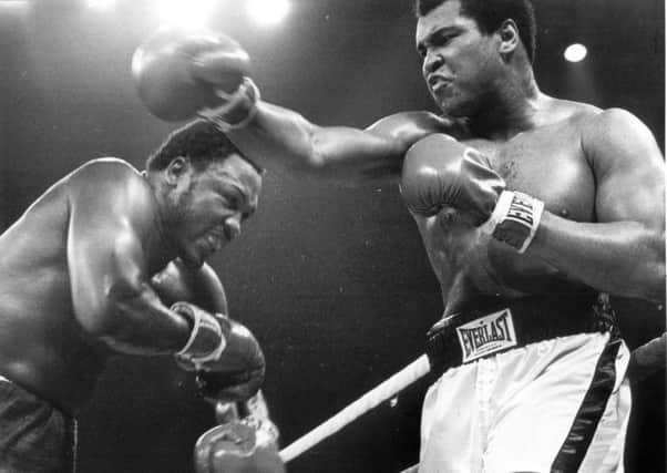 Muhammad Ali, right, fighting Joe Frazier