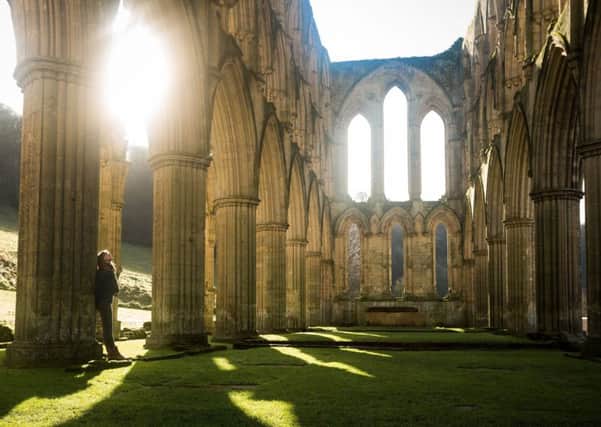 The ruined interior of Rievaulx Abbey near Helmsley in North Yorkshire, seen from down the nave. Photo: Jo Denison/English Heritage/PA Wire