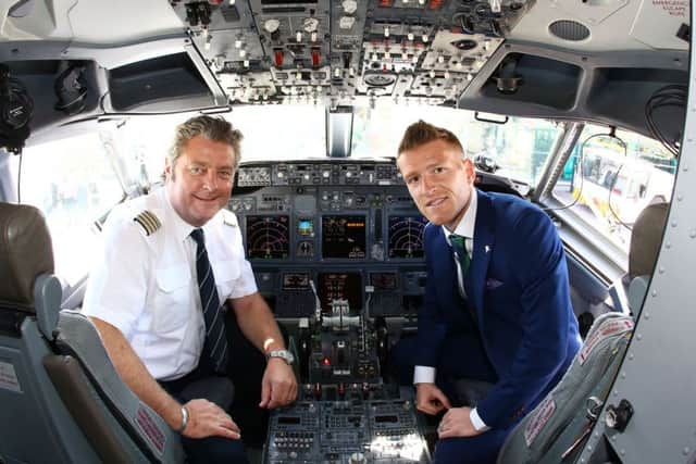 Press Eye - Belfast -  Northern Ireland - 30th May 2016 - Photo by William Cherry

 Northern Ireland's captain Steven Davis pictured with airline captain Vladimir Korosec as they leave from George Best Belfast City Airport to take part in a training camp in Austria in advance of the 2016 Euros.
