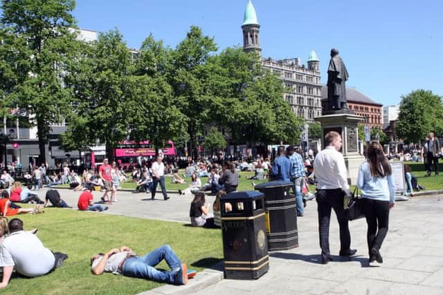Crowds in the grounds of Belfast City Hall at lunchtime yesterday. Picture by Freddie Parkinson/Press Eye