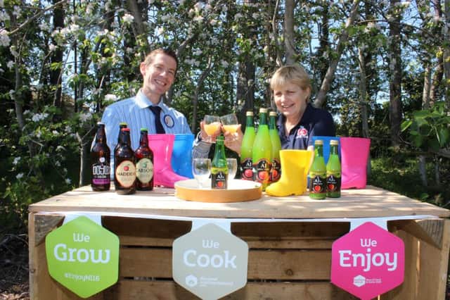 Ian Danton, Tesco Portadown Store manager raises a glass with Helen Troughton, owner, Armagh Apple Farm who is taking part in Bank of Ireland Open Farm Weekend 2016, 18th & 19th June. Armagh Apple Farm is celebrating ten years in business and is a supplier to Tesco Northern Ireland stores.