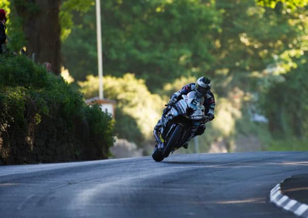 Michael Dunlop on the Hawk Racing BMW at the K-Tree during Isle of Man TT practice.