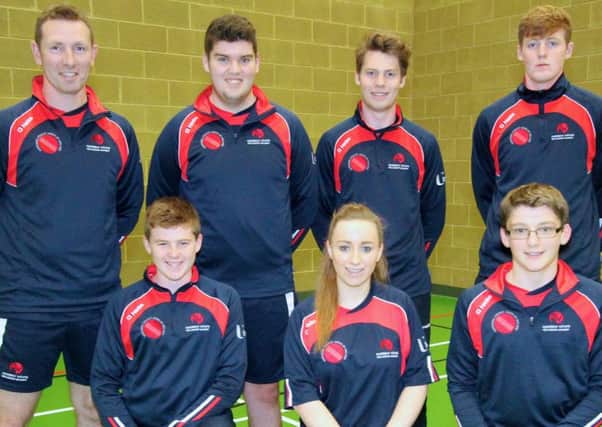 Ballymena's John Glass (front row, far right) with some of his team-mates at the Andrew White Academy, along with the former Ireland international cricketer.