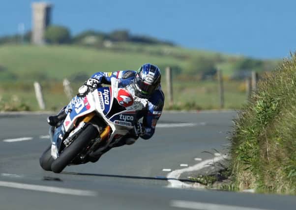 Ian Hutchinson set an unofficial outright lap record of 132.803mph on his Tyco BMW Superstock machine during Isle of Man TT practice on Friday.