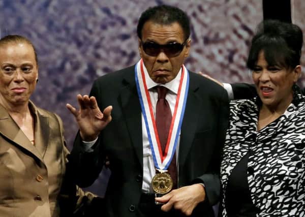 Muhammad Ali  alongside his wife Lonnie Ali  and his sister-in-law Marilyn Williams