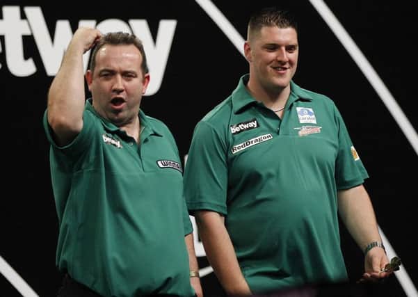 Brendan Dolan and Daryl Gurney celebrate their win over Japan. Pic by Lawrence Lustig/PDC