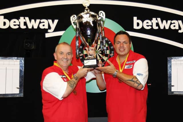 World Cup winners Phil Taylor and Adrian Lewis. Pic by Lawrence Lustig/PDC