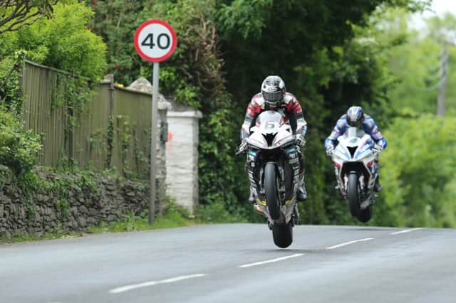 DAVE KNEEN/PACEMAKER PRESS, BELFAST: 04/06/2016: Michael Dunlop (BMW - Hawk Racing) and Ian Hutchinson (BMW - Tyco BMW) at Ballacrye during the RST Superbike TT race.