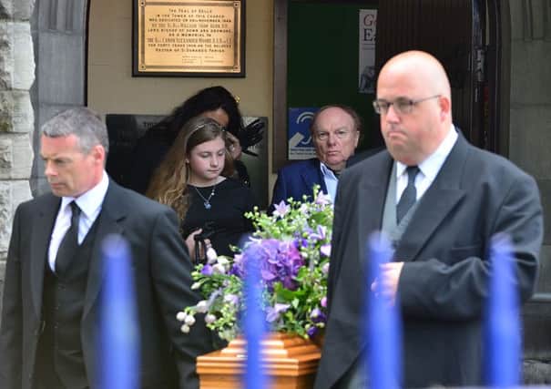 Van Morrison (second right) watches as his mother Violet's coffin is removed from St Donard's Parish Church, Bloomfield, in east Belfast