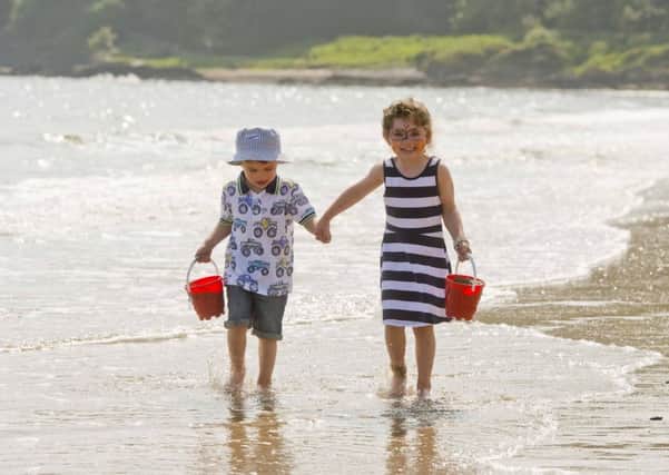 Clara and Jimmy Bannon enjoy the hot weather at Helens Bay Co Down.    Picture Mark Marlow/Pacemaker press