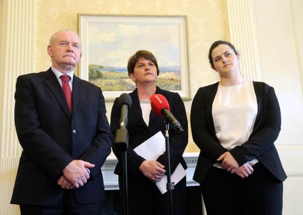 First Minister Arlene Foster (centre), deputy First Minister Martin McGuinness and Justice Minister Claire Sugden