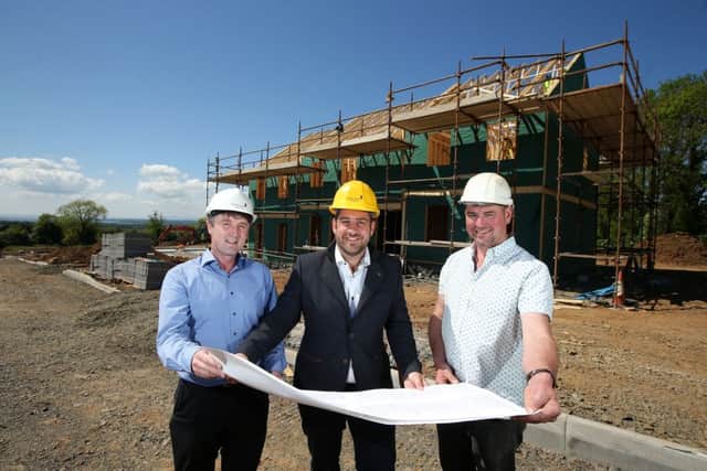 Hagan Homes MD Jamesy Hagan, centre, with Hagan director Jim Burke, left, and James McLaughlin, MD of Claudy-based JCL Contracts