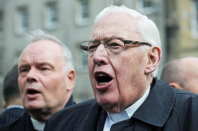 The Reverend Ian Paisley (right) joins a protest in Edinburgh against the visit of Pope Benedict XVI who arrived in the city earlier in the day for a four day visit to the United Kingdom. PRESS ASSOCIATION Photo. Picture date: Thursday September 16, 2010. The Rev Paisley, now Lord Bannside, had mounted a protest in the Liverpool in 1982 against the visit of John Paul II. See PA story RELIGION Pope. Photo credit should read: Anna Gowthorpe/PA Wire