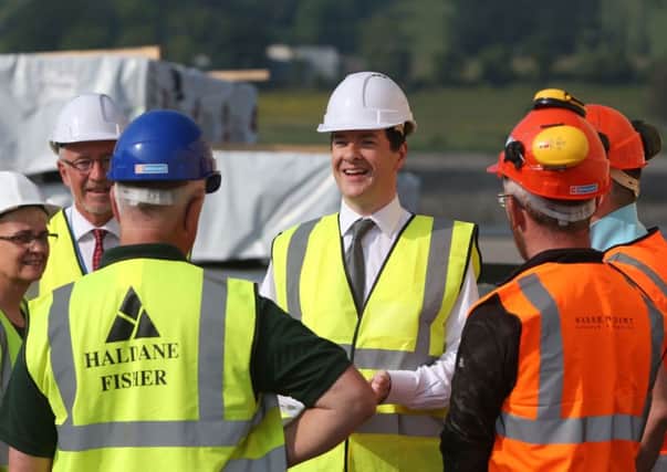 Chancellor George Osborne chats to workers during his visit to Warrenpoint earlier this week