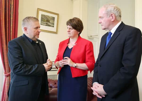First Minister Arlene Foster and Deputy First Minister Martin McGuinness with Father Gary Donegan (left) at Stormont Castle in Belfast