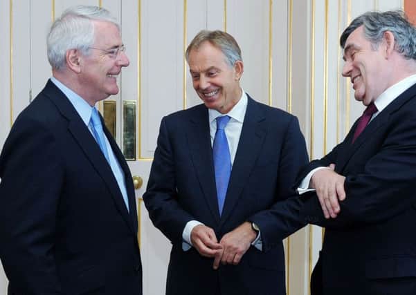 Former Prime Ministers Sir John Major, Tony Blair and Gordon Brown chat before posing for a photograph with the Queen and Prime Minister David Cameron, ahead of a Diamond Jubilee lunch hosted by Cameron at 10 Downing Street, London.