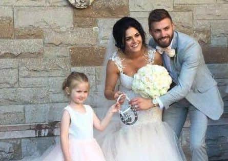 Stuart and Juneve with daughter Pixie on their wedding day