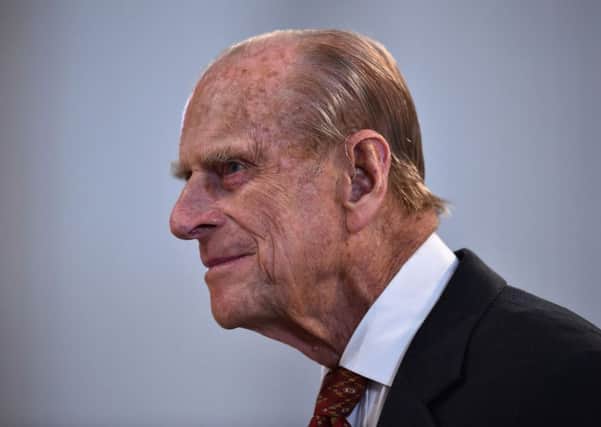 The Duke of Edinburgh leaves St Paul's Cathedral in London after a national service of thanksgiving to celebrate the 90th birthday of Queen Elizabeth II.