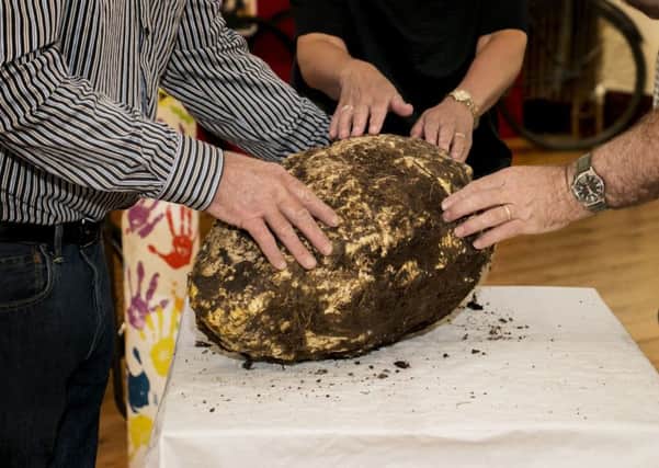 Undated handout photo issued by the Cavan County Museum of a prehistoric 10 kilo lump of bog butter thought to have been a gift to the gods which was found by turf cutters
