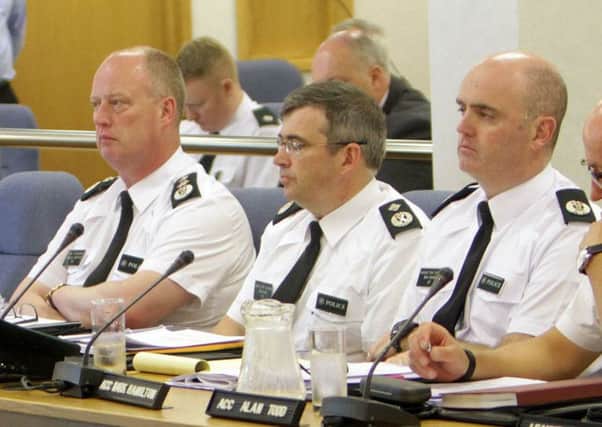 ACC Mark Hamilton (right) with Chief Constable George Hamilton (left) and Deputy Chief Constable Drew Harris at the Policing Board meeting