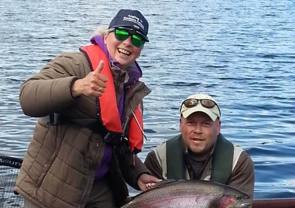 Irish Ladies Flyfishing Team member Liz Dermott, Portadown with her 12lb trout on Carron Valley Reservoir, Stirling, with her  boatman,  International  Angler  Brian Kerr, Armagh