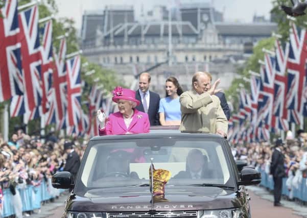 Queen Elizabeth II and the Duke of Edinburgh with the Duke and Duchess of Cambridge and Prince Harry make their way down The mall in an open topped Range Rovers,  during the Patron's Lunch in The Mall, central London in honour of the Queen's 90th birthday: Sunday June 12, 2016.