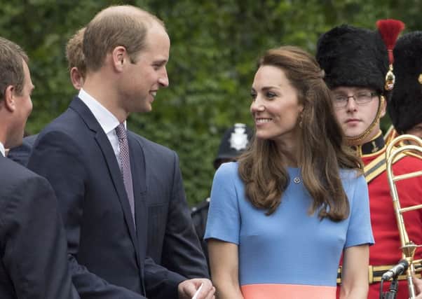 The Duke and Duchess of Cambridge greet well wishers on The Mall, during the Patron's Lunch in central London in honour of the Queen's 90th birthday. Photo: Arthur Edwards/The Sun/PA Wire