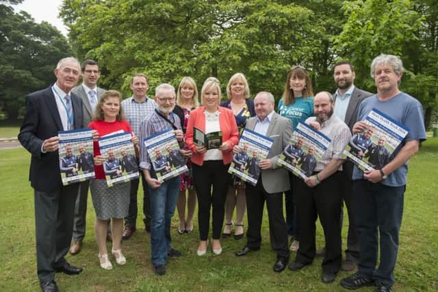 Members of the Men's Health Week Planning group meet with Health Minister Michelle O'Neill to chat about the launch of Men's Health Week 2016.