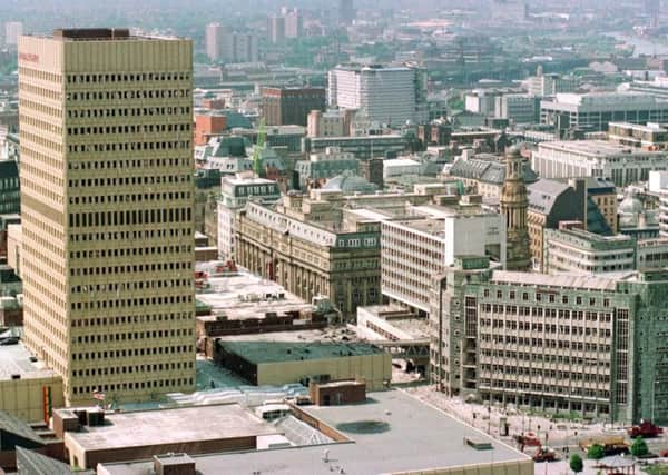 File photo dated 17/06/96 of an aerial view of Manchester city centre showing the bomb-damaged Arndale Centre (left) and Marks & Spencer in Corporation Street (bottom right)