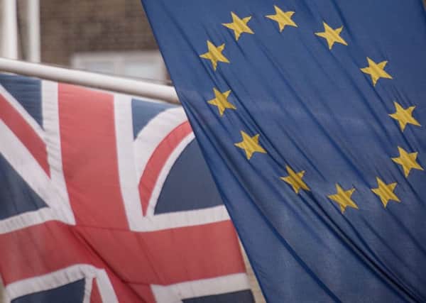 EU and UK flags fly above the EU Commission offices in Westminster, London. Photo: Stefan Rousseau/PA Wire