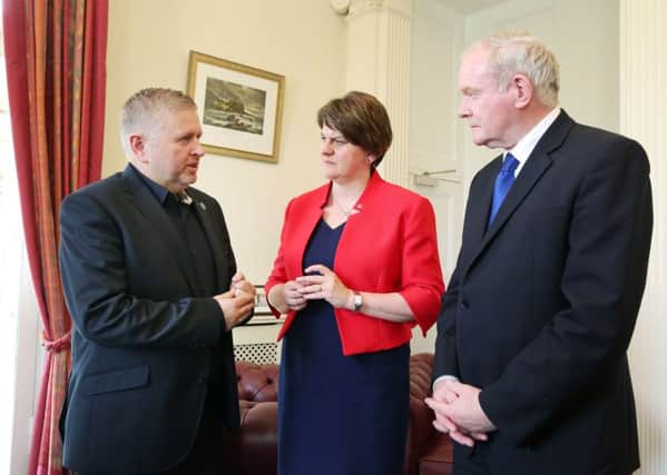 Father Gary Donegan
 with First Minister Arlene Foster and Deputy First Minister Martin McGuinness at Stormont Castle to express their support for him. Photo by Kelvin Boyes / Press Eye