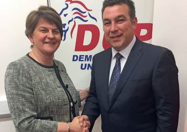 Alastair Patterson being welcomed as a DUP member by Arlene 
Foster