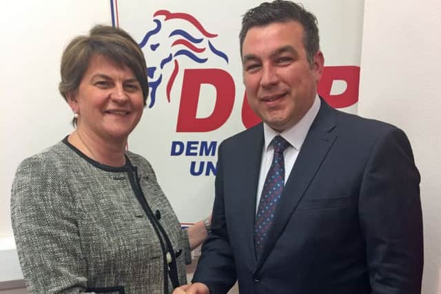 Alastair Patterson being welcomed to the DUP by Arlene Foster