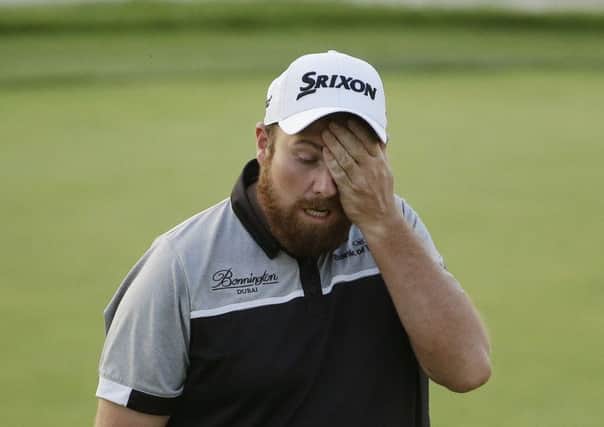 Shane Lowry walks off the 18th green after the final round of the U.S. Open