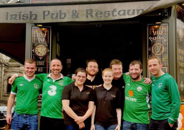Alan Sheehan (third from right) with his staff and Irish fans outside his pub in Lille, France, who are preparing for a fan invasion by getting dozens of extra kegs of Guinness. PRESS ASSOCIATION Photo. Picture date: Monday June 20, 2016. Sheehan, 44, is originally from Maynooth in Co Kildare and is braced for the arrival of thousands of Irish fans ahead of the Republic's must-win Euro 2016 tie with Italy on Wednesday night. See PA story SPORT Euro2016 IrelandKegs. Photo credit should read: Catherine Wylie/PA Wire