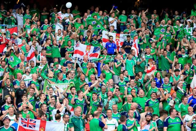 Northern Ireland fans show their continued support in the stands following the UEFA Euro 2016, Group C match at the Parc Des Princes, Paris. PRESS ASSOCIATION Photo. Picture date: Tuesday June 21, 2016. See PA story SOCCER N Ireland. Photo credit should read: Jonathan Brady/PA Wire. RESTRICTIONS: Use subject to restrictions. Editorial use only. Book and magazine sales permitted providing not solely devoted to any one team/player/match. No commercial use. Call +44 (0)1158 447447 for further information.