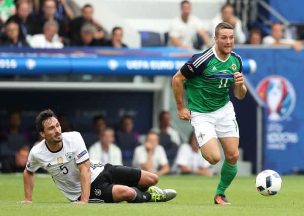 Northern Ireland's Conor Washington with Germany's Mats Hummels