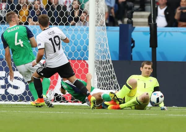 Northern Ireland's Michael McGovern makes another save against Germany