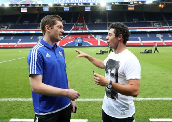 Rory McIlroy pictured with Northern Ireland goalkeeper Michael McGovern after Tuesday night's game against Germany in Paris