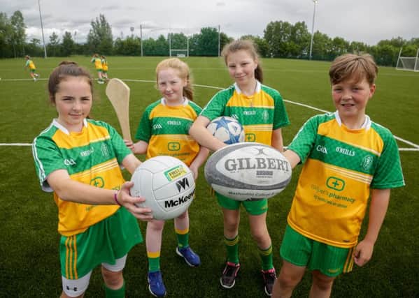 Pupils from Bunscoil Phobail Feirste enjoy trying out the new multisport pitches