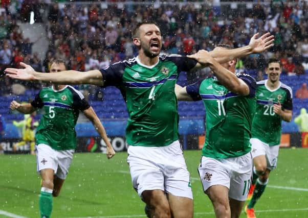 Gareth McAuley celebrates his goal against Ukraine that helped earn Northern Ireland their place in the last 16