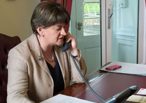 First Minister Arlene Foster is pictured on a phone call at 11.20am on Friday speaking with Prime Minister David Cameron in her office at Stormont Castle after the UK backed Brexit.

Photo by Press Eye