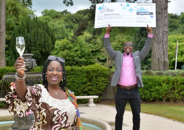 Youre never Ghana believe it! - Helena Panford (59), originally from Ghana, pictured with her brother, Patrick, won a staggering one million pounds after her bus broke down on the way to work
