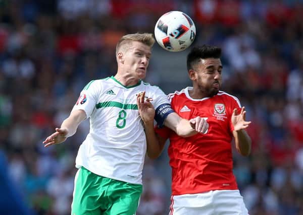 Northern Ireland's Steven Davis and Wales' Neil Taylor