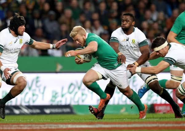 Ireland's Stuart Olding
 charges through the South African defence