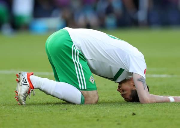 Kyle Lafferty dejected after Northern Ireland's defeat