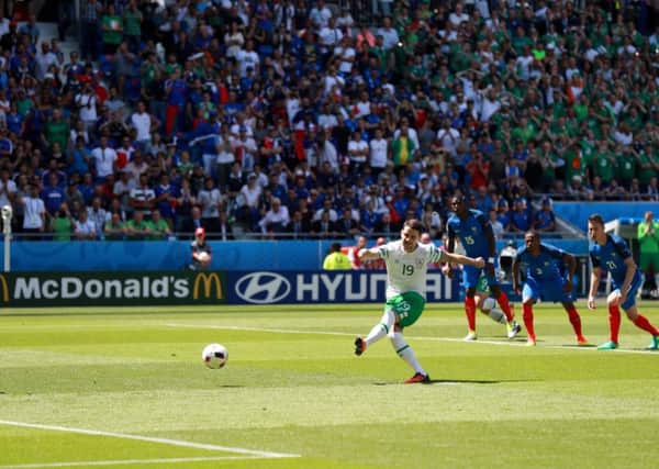 Republic of Ireland's Robbie Brady scores a penalty to give his side a 1-0 lead against France