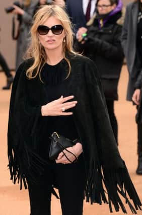 Kate Moss is a proponent of the 'throwing things off' trend